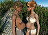 2 legal age teenager preggy angels are caressing every other on the beach.